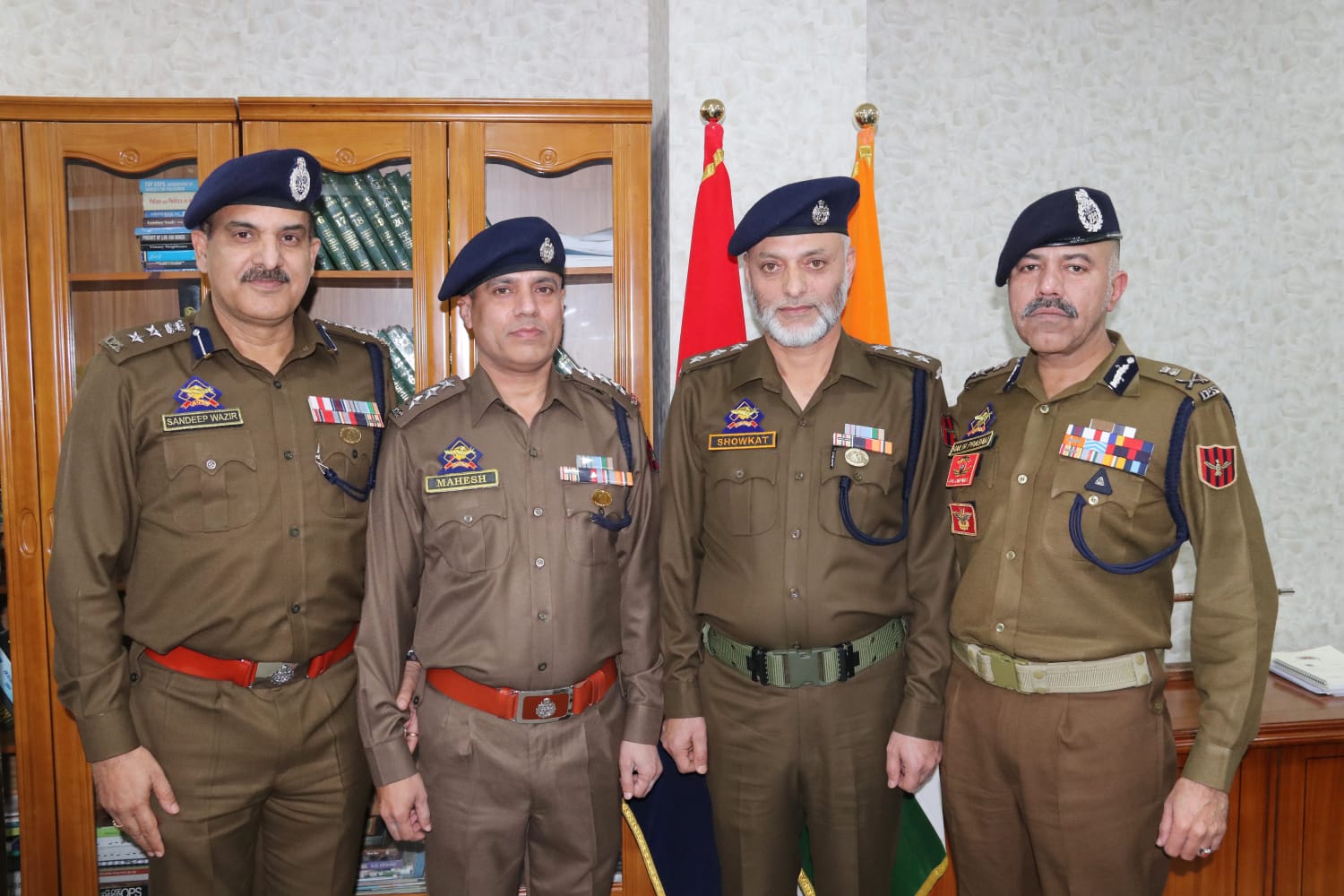 'Shri Nalin Prabhat, Director General of Police, J&K, conducted the pipping of the newly promoted Deputy Superintendents of Police,  Showket Ahmad Dar and  Mahesh Gupta in the presence of  Sandeep Wazir, AIG (Personnel) and Syed  Al-Tahir Gillani,  SO to DGP, J&K,'